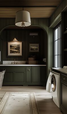 a washer and dryer in a room with wood paneling on the walls