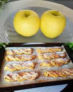 two apples and some pastries on a tray