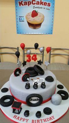 a birthday cake decorated with black and white decorations