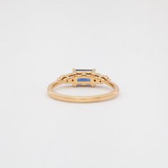 The high contrast combination of vivid blue sapphires and twinkling white diamonds has stood the test of time and Anna Sheffield makes it her own with this compact ring that's easy to wear, yet loaded with personality. The east-west setting is a perfect way to turn a sizable sapphire into an everyday statement. Understated brides and gemstone lovers will both find something to love about this ring. Designed in New York. 14 karat gold set with an approximately 0.75 carat (6 mm x 4 mm) emerald-cut Timeless Blue Sapphire Ring With Rose Cut Diamonds, Blue Sapphire Ring With Rose Cut Diamonds, Emerald Cut, Timeless Emerald-cut Sapphire Ring, Emerald Cut Blue Ring With Rose Cut Diamonds, Blue Emerald Cut Ring With Rose Cut Diamonds, Timeless Baguette Cut Sapphire Ring, Timeless Sapphire Rings With Lab-created Sapphire, Timeless Blue Diamond Ring With Rose Cut Diamonds, Timeless Blue Diamond Ring With Rose Cut