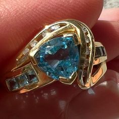 14k Yellow Gold Blue Topaz Diamond Ring In A Size 7. It Looks Brand New. It Sparkles So Much! It Weighs Approximately 4.33 Grams. The Inside Is Stamped 14k Cgj. Box Not Included. Inventory 11 Fine Jewelry Yellow Gold Trillion Cut Sapphire Ring, Blue Brilliant Cut Topaz Ring For Anniversary, Formal Trillion Cut Topaz Ring In Fine Jewelry Style, Formal Trillion Cut Topaz Fine Jewelry Ring, Anniversary Sapphire Multi-stone Topaz Ring, Yellow Gold Blue Topaz Ring Fine Jewelry, Sapphire Multi-stone Topaz Ring For Anniversary, Multi-stone Blue Topaz Ring For Formal Occasions, Blue Trillion Cut Ring Fine Jewelry