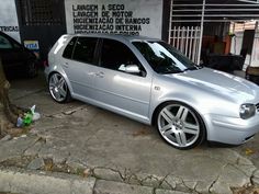 a silver car parked in front of a building