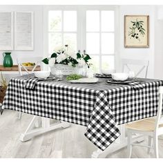 a black and white checkered table cloth on a dining room table