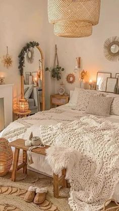 a bedroom with a large bed covered in blankets and pillows next to a fire place