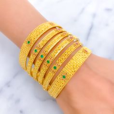 Elevate your style with our Vibrant Festive Floral 22K Gold Bangle Set. Crafted in 22k gold, this exquisite set features a total weight of 109.2g, radiating opulence. Adorned with stunning Kundan stones, the yellow gold finish adds a touch of high fashion. Bangle Size 2.6 with a 2.35" diameter opening. Set includes 6 captivating bangles. PRODUCT DETAILS Gold Purity(karat): 22k Item Weight(grams): 109.2 Item Finish: Yellow Gold Stone: Kundan Bangle Size: 2.6 Bangle Opening(diameter): 2.35" Number 22k Gold Meenakari Bangle In Yellow Gold, 22k Yellow Gold Meenakari Bangle, 22k Yellow Gold Bangle With Meenakari, Hand Set 22k Gold Festive Bracelets, Yellow 22k Gold Bracelet For Festive Occasions, Yellow 22k Gold Festive Bracelet, Festive 22k Gold Yellow Bracelets, Festive Yellow 22k Gold Bracelet, Luxury Gold Bangle For Festive Season