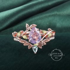 Art Deco Pear Lavender Amethyst engagement ring Bridal Set Rose Gold Unique Leaf Nature Inspired  Gemstone Promise Cluster ring jewelry Gift (Please comfirm your US size when you make an order) Jewelry details: Matal Type: 14k gold /18k gold Engagement Ring: Center Stone: Lavender Amethyst Stone Size: 6*8mm Side stones: peridot Total weight: 0.18ctw (High Quality) Wedding band Moss Agate and moissanite Carat Weight: approx. 0.182ctw Or: black sapphire (If you choose side stone in black sapphire) Purchase Guarantee: 1: Provide you with the best service. 2: 14 Day Refund Guarantee. 3: Free Gift Box&Packing 4: Free Shipping and insurance to All Parts Of The World. Accessories: beautiful Ring box, and little gifts. Processing time: When we receive payment We need 2-3 weeks to work for your ite Exquisite Amethyst Ring For Wedding, Rose Cut Amethyst Jewelry For Wedding, Purple Amethyst Ring With Rose Cut Diamonds For Wedding, Purple Rose Cut Diamond Jewelry For Wedding, Pink Amethyst Ring With Gemstone Accents For Wedding, Pink Amethyst Jewelry For Wedding, Morganite Multi-stone Jewelry For Anniversaries, Morganite Multi-stone Jewelry For Anniversary, Exquisite Amethyst Wedding Ring With Gemstone Accents