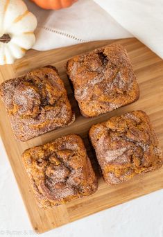 pumpkin bread mini loaves on a cutting board with cinnamon sugar crunch in the middle