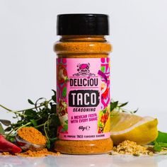 a jar of delicious taco seasoning next to some vegetables