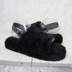 Kendall And Kylie Women's Black Faux Fur Open Toe Slides Slippers Size 11 New Without Tags Black Slippers With Faux Fur Lining, Black Synthetic Slippers With Faux Fur Lining, Comfortable Black Slippers With Faux Fur Lining, Trendy Black Closed Toe Slippers, Black Closed Toe Winter Slippers, Black Flat Heel Slippers For Winter, Black Flat Heel Winter Slippers, Black Flat Slippers For Winter, Black Casual Slippers With Faux Fur Lining