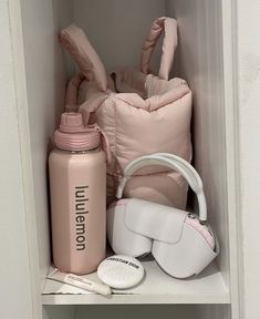 the contents of a baby's diaper sit on a shelf in a closet