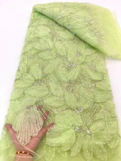 This high quality Fabric is measured in 5 Yards With Embroidered Beading and Sequin. It is soft, very delicate and beautiful. This high Quality Fabric is made with Fashion embroidered rhinestones can be used in making party wedding dresses, skirts, shawls, scarves and other other fashion apparels as you would like. Size : Length : 5 yards (180 inch). Width: 50 inch (Please allow slight deviation for the measurement data ,±1 inch) Material: 100% Polyester, Tulle Lace Fabric, Eco-Friendly embroide Green Sequin Fabric For Spring Party, Fitted Green Fabric With Floral Embroidery, Fitted Green Floral Embroidered Fabric, Fitted Green Embroidered Fabric With Sequins, Green Embroidered Fabric For Spring Wedding, Elegant Green Sequin Fabric, Green Embroidered Fabric With Sequins For Festive Occasions, Green Embellished Embroidered Fabric For Party, Elegant Green Embroidered Fabric With Sequins