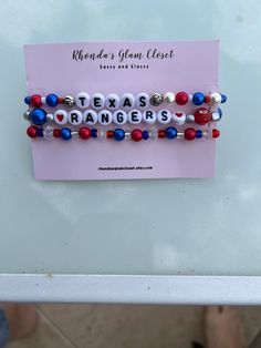 Beaded Texas Rangers red, white, and blue bracelet set. You can choose the size (7.0 is the standard size). Great gift for Rangers opening Day, Baseball game, Baseball lover, Dinner party, Girls night, Birthday parties, matching your outfit, Stylish and cute. Rangers Baseball Game Outfit, Texas Rangers Outfit, Texas Rangers Stadium, Texas Rangers Shirts, Baseball Jewelry, Valentines Bracelets, Valentines Earrings, Fun Bracelet, Stylish Bracelet