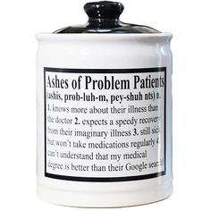 a white canister with black writing on the front and bottom, which reads ashes of problem patients