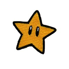 a yellow and black star patch with two eyes on it's side, in the shape of a smiley face