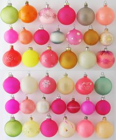 there are many different colored ornaments hanging on the wall