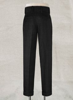 Be the best-dressed in order to be a gentleman that demands perfection. Crafted from wool blend, our Napoleon Black Stone Double Gurkha Wool Trousers are elegant with a smooth and rich effect that exudes style and utmost comfort. An essential pants for your wardrobe which will make your ensemble exceptional. 
 
 Look Includes  Napolean Stone Black Wool Fabric  Cross Pocket  Two Pleated Front  Double Button Fastening Wide Waistband  Diamond Pocket On Right  1.5inch Trouser Cuffs  Two Welted Back Classic Winter Pants With Welt Pockets, Fitted Full-length Dress Pants For Winter, Formal Winter Bottoms With Welt Pockets, Winter Formal Slim Fit Pants, Tailored Full-length Dress Pants For Winter, Elegant Wool Dress Pants For Workwear, Luxury Tapered Leg Dress Pants For Semi-formal Occasions, Luxury Fitted Dress Pants, Formal Wool Dress Pants With Pressed Crease