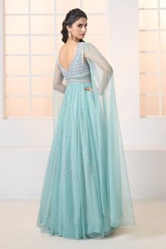 Teal blue soft net gown with all-over hand embroidery, cascading draped sleeves and tassel details on shoulders. - Aza Fashions Light Blue Maxi Evening Dress For Wedding, Light Blue Maxi Length Evening Dress For Wedding, Elegant Light Blue Gown For Reception, Floor-length Evening Dress With Sheer Dupatta For Wedding, Blue V-neck Gown For Wedding, Light Blue Fitted Gown For Reception, Fitted Light Blue Gown For Reception, Festive Blue Evening Dress For Wedding, Light Blue Floor-length Gown For Gala