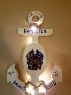 a lighted sign on the wall that says hamillon, ship 17 bravo - zuiu