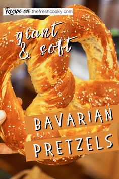 a person holding up a pretzel with the words grant & scott bavarian pretzels