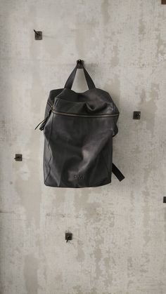 This stunning backpack is made of genuine soft nappa leather in a Ash Black color. With enough room for all your daily essentials, It is perfect for everyday use, as well as for laptops of most sizes, IPAD, A4 files, books and travel. It offers a spacious, lined interior with two large compartments, a zipper pocket, and adjustable straps. The antique gold hardware adds a touch of elegance and modernity to the overall look. Features: * 1 Interior large zipped pocket * Outside zipper pocket in the Functional Leather Backpack With Leather Handles, Everyday Leather Backpack, Everyday Leather Standard Backpack, Functional Leather Softback Backpack For Daily Use, Leather Softback Backpack With Zipper Closure, Travel Backpack In Soft Leather, Functional Leather Softback Bag, Functional Softback Leather Bag, Modern Soft Leather Backpack For On-the-go