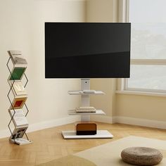 a flat screen tv sitting on top of a wooden stand in a living room next to a window