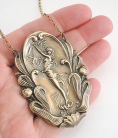 "Art Nouveau Necklace - Statement Necklace - Vintage Necklace - Vintage Brass Necklace - Goddess Necklace - handmade jewelry This is such a beautiful vintage necklace! A large brass Art Nouveau pendant hangs from a pretty vintage brass ladder chain. Incredible detail. So very bold and feminine. Chloe says, \"Wear it and feel fabulous!\" This pendant is 3 3/4\" tall and 2\" wide. You can choose the necklace length you would like at checkout. Thanks for visiting Chloe's" Vintage Necklace With Antique Finish As Gift, Vintage Antique Finish Necklace As Gift, Vintage Antique Finish Necklace For Gift, Decorative Antique Gold Necklaces For Gifts, Decorative Antique Gold Necklace For Gift, Vintage Bronze Necklaces With Large Pendant, Vintage Antique Gold Necklace Gift, Vintage Bronze Jewelry For Crafting, Handmade Antique Gold Necklaces For Vintage Collection