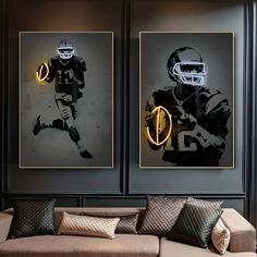 two framed football players are on the wall in this living room