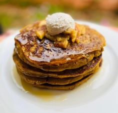 a stack of pancakes with ice cream on top