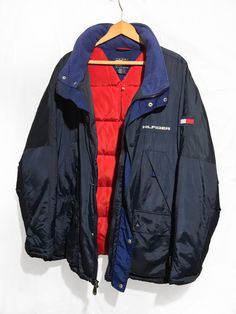 Vintage 90s Tommy Hilfiger Goose Down Proof Hooded Parka jacket Block Logo Spell Out Multi Pocket Navy Blue Size XL Condition: Normal Trace of Use Overall Good Size: X-Large lenght : 31,5 Pit to Pit: 27.5 Arms: 26 Any questions just ask! Please keep in mind that colours from the pictures may vary because of your screen. I SEND WITH TRACKING NUMBER! If any item is lost or damaged in transit I will make a claim with the Post Office but refunds will not be given until the claim has been processed. 90s Style Outerwear With Pockets For Winter, 90s Style Outerwear With Pockets For Fall, Vintage Blue Outerwear For Outdoor Activities, Blue Winter Outerwear With Multiple Pockets, 90s Style Fall Outerwear With Pockets, 90s Style Winter Windbreaker With Pockets, Navy Hooded Jacket With Pockets For Winter, 90s Style Hooded Outerwear For Outdoor, 90s Style Long Sleeve Outerwear For Outdoor Activities