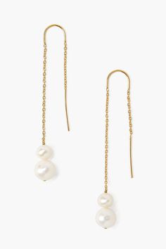 The modern thread-thru earring gets a touch of classic style with the addition of floating pearls. These lightweight earrings feature luminous freshwater white pearls on an 18k gold plated sterling silver chain. Cheap White Pearl Drop Jewelry, Cheap White Drop Jewelry, Cheap White Minimalist Earrings, Cheap Minimalist White Earrings, Cheap Gold Earrings With Pearl Chain, Cheap Pearl Drop Jewelry For Party, Cheap Chic Pearl White Jewelry, Cheap Chic White Jewelry, Luxury Modern Pearl Chain Earrings