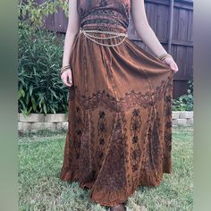 Brown Embroidery Maxi Skirt, Perfect For Embracing Those Boho Hippie Vibes! This Stunning Skirt Features Pleated Border That Adds A Touch Of Elegance, While The Maxi Length Offers A Chic And Comfortable Fit.Crafted With Fairycore Fashion In Mind, This Skirt Is Ideal For Creating Enchanting Cottage Core Looks. Whether You're Strolling Along Sandy Shores Or Exploring Hideaways, This Skirt Will Ensure You're Dressed To Impress. Its Flowing Silhouette Captures The Essence Of Fairycore Aesthetics, Ev Afro Boho Fashion, Vibe Brown, Shifting Wardrobe, Hippie Fits, Fairycore Fashion, Brown Embroidery, Hippie Skirt, Hippie Skirts, Dressed To Impress