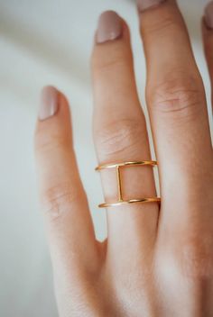 This is a gorgeous, trend-setting ring made of thick, 14K Gold metal. Two gold stacking rings are held in place by evenly spaced gold bars. This ring is perfect from all angles and is a great fit for men or women! This ring is incredibly lightweight and yet still very noticeable — it makes a perfect ‘daily wear’ ring and is quickly becoming one of our most popular Unisex styles! This listing is for ONE SINGLE Cage ring. This LARGE version measures approximately 1/2 of an inch (12mm) wide.Made fr Modern Gold Stackable Initial Ring, Modern Gold Initial Ring With Open Band, Modern 14k Gold Wide Band Ring With Open Shape, Modern 14k Gold Wide Band Ring With Open Band, Modern 14k Gold Wide Band Open Ring, Modern Wide Band Gold Ring, Timeless Gold Double Band Stackable Rings, Modern Gold Midi Rings With Open Band, Modern Gold Midi Ring With Open Band