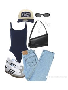 a woman is wearing a blue bodysuit, jeans and adidas sneakers while holding a black purse