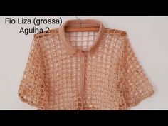 a crocheted sweater hanging on a clothes hanger with the words filizza grossa against it