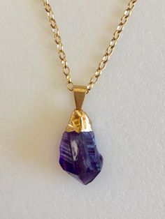 "Lovely statement boho necklace featuring beautiful rough amethyst quartz point with 24k gold electroplated cap. Hammered look with smooth edges for comfort. Choose from 4 natural purple amethyst quartz. Please see last photo above for choices. #1. 7/8\" x 1/2\" and 1 1/4\" long from top of bail. Slight clear crystal quartz inclusion appears naturally on the front. #2. 1 1/4\" x 7/8\" and 1 1/2\" from top of bail. #3. 1 7/8\" x 7/8\" and 1 5/8\" from top of bail. Crystal is double terminated. #4 Amethyst Pendant Necklace With Raw Stone, Amethyst Gemstone Amulet Necklace, Purple Faceted Amethyst Crystal Necklace, Handmade Amethyst Amulet Crystal Necklace, Custom Charm Bracelet, Amethyst Crystal Necklace, Gold Amethyst Crystal Necklace, Faceted, Amethyst Point, Sea Glass Earrings