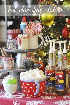 hot chocolate station in front of a christmas tree