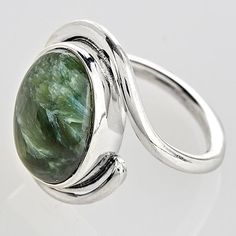 A stone mined in Siberia, exotic Seraphinite is named after angels. Reflective like cat's eye, it has feathery "plumes" like the wings of seraphim. Oval cabochons are set in sterling silver bezels. Ring with wraparound band is ¾"; whole sizes 6-10.