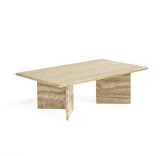 a wooden table sitting on top of a white floor next to an object that looks like a piece of wood