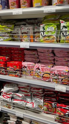 an assortment of food items on display in a grocery store, including rice and other foods