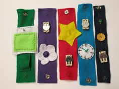 four different colored pieces of fabric with buttons and flowers on them, one has a watch