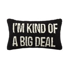 a black and white pillow that says i'm kind of a big deal