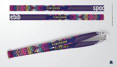 two skis with colorful designs on them and the words finisher written in gold