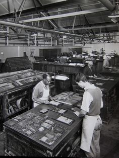 two men are working in an old factory