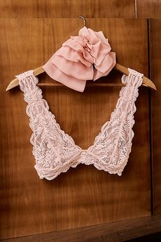 Made for every day, this lace bralette is featured in a pull-on style and sheer fabrication with a plunging neckline and low back. **Fit:** Pull-on style **Features:** Sheer lace fabrication, scallop trim, plunging neckline, fixed shoulder straps, low back, side boning for a supportive fit **Why We | Last Dance Lace Plunge Bralette by Intimately at Free People in Pink, Size: L Lace Bodice Bra For Weddings, Feminine Lace With Built-in Bra, Feminine Lace Wedding Bra, Delicate Lace Low-cut Feminine Bra, Feminine Delicate Lace Low-cut Bra, Feminine Triangle Top Bra With Delicate Lace, Spring Party Bra With Delicate Lace, Lace Bra With Lace Closure For Spring, Spring Lace Bra With Lace Closure