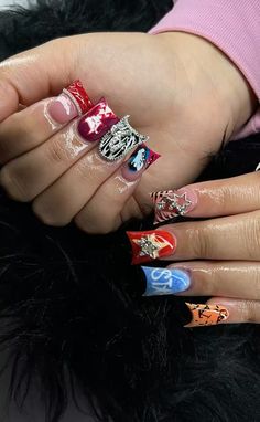 a woman's hands with different nail designs on them