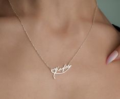 "Personalized Name Necklace With Heart, Custom Name Jewelry, Sterling Silver Name Necklace, Handmade Name Necklace, valentine's day gift TO OUR VALUED CUSTOMERS ! Please take a look at our special catalog that we have prepared for you !  ▶ https://www.etsy.com/shop/DaintyMark D E T A I L S * Made to Order. * Handmade with Sterling %100 925K Sterling Solid Silver. * Choice of Gold Color: Gold, Rose Gold, Silver * Length: 14\", 16\", 18\", 20\", 22\"  * Ready to Ship in 1-3 Business Days * Free returns within 14 days from the order date. A B O U T ∙ U S * All personalization is done by hand. Because it's better that way. * 100% Ethically Sourced raw materials. * Our lovely packaging is made with love and passion. * Handcrafted by our trusted craftsmen with care. G I F T ∙ T I M E We love gif Customizable Heart Pendant Necklace For Gift, Heart Charm Nameplate Jewelry Gift, Name Heart Pendant Necklace As A Gift, Custom Name Heart Necklace For Her, Customizable Pendant Necklaces For Valentine's Day, Custom Pendant Necklace For Valentine's Day, Customized Pendant Necklace For Valentine's Day, Customizable Pendant Necklace For Valentine's Day, Heart Pendant Name Jewelry For Gift