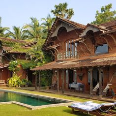 a large house with a pool in front of it