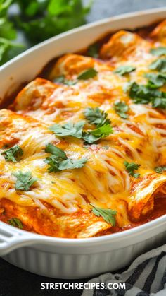 a casserole dish with cheese, sauce and parsley on the top is ready to be eaten