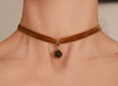 Bronze rose beige velvet ribbon choker Choker -necklace with beige velvet ribbon and charm- bronze rose. Flower's dia 15-17 mm Length of choker is adjustable: 28-33 cm/11-13 inch or 33-38 cm/13-15 inch or 14-16 inch/ 35.5 cm-40.6 cm Width of ribbon 10 mm / 0.4 inch If you need other length of necklace let me know and I will make it for you. ♥All my jewelry come in boxes or bags . If you are purchasing a gift I am happy to include personalised messages with your order. Please leave a note of desi Polymer Clay Choker, Rose Gold Choker For Gift, Clay Charm Necklace, Ribbon Choker Necklace, Rose Choker, Velvet Necklace, Blue Choker, Polymer Clay Flower Jewelry, Ribbon Choker