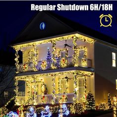 a large house covered in christmas lights and decorated with holiday decorations on the front porch